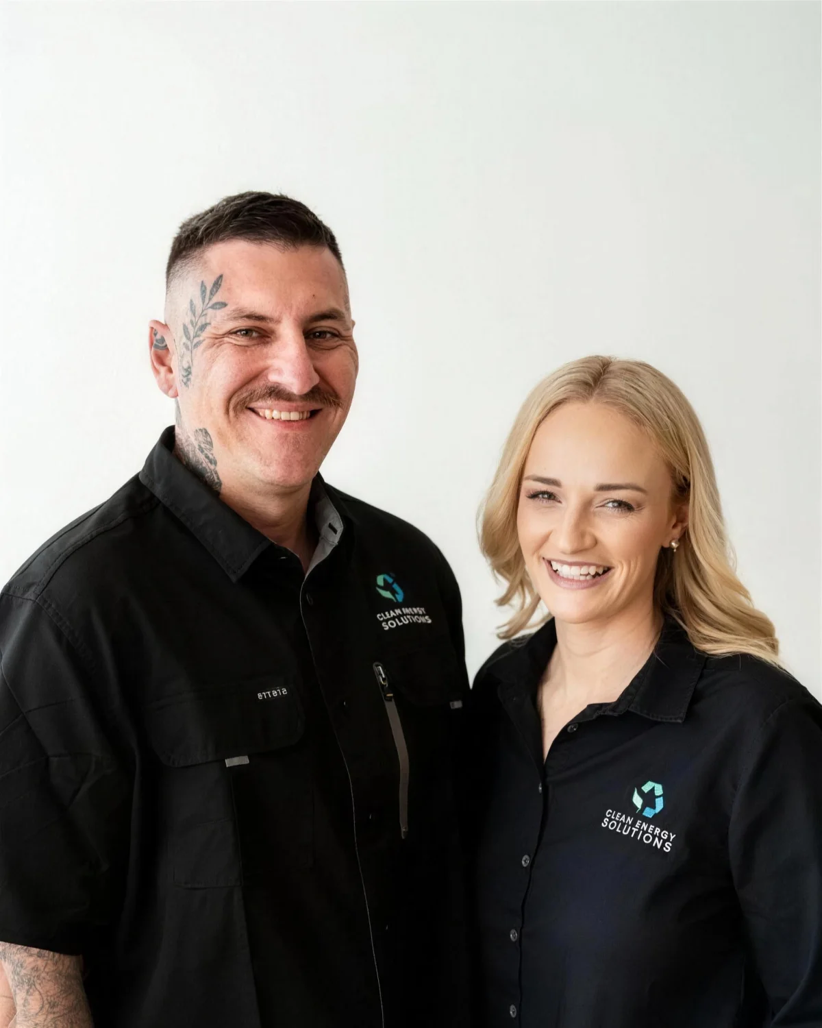 Two CES team members in company uniforms